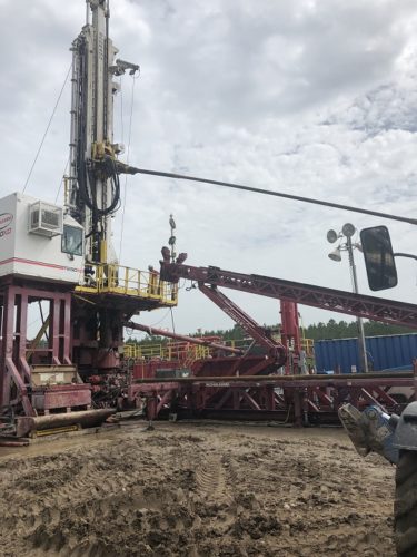 drilling rig with stuck pipe service call